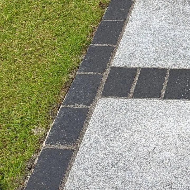 black limestone cobbles edging